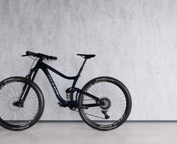 eliteX grijze betonlook wand met een fiets